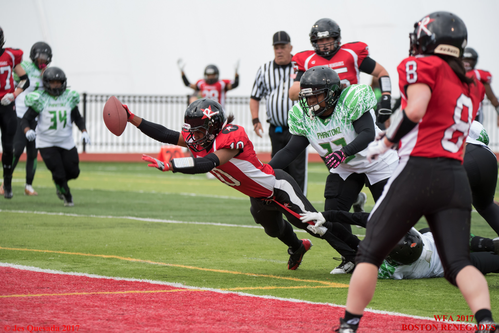 Boston Renegades wide receiver Adrienne Smith #10 stretches to cross the goal line and score her second of three touchdowns against the Philadelphia Phantomz on June 3, 2017. Β©Jes Quesada, Game On Photo.