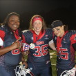 Boston Renegades Come to Revere (Daily Item) Steph Jeffers #66 OL, Emily Weinberg #36 TE, and Vicky Eddy #45 LB, celebrate victory in the gold medal round of the International Federation of American Football's Women's World Championship in Langley, British Columbia, Canada on June 30, 2017. © 2017 Kate Slack.