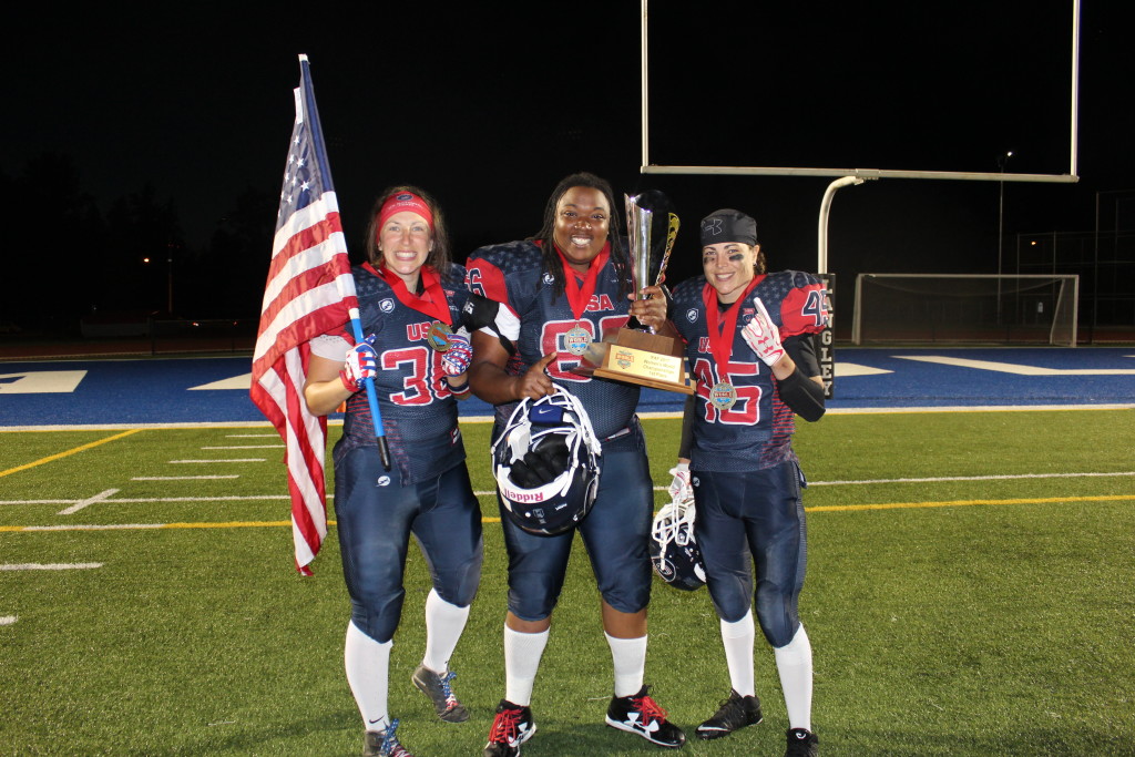 Emily Weinberg #36 TE, Steph Jeffers #66 OL, and Vicky Eddy #45 LB, celebrate victory in the gold medal round of the International Federation of American Football's Women's World Championship in Langley, British Columbia, Canada on June 30, 2017. © 2017 Kate Slack.