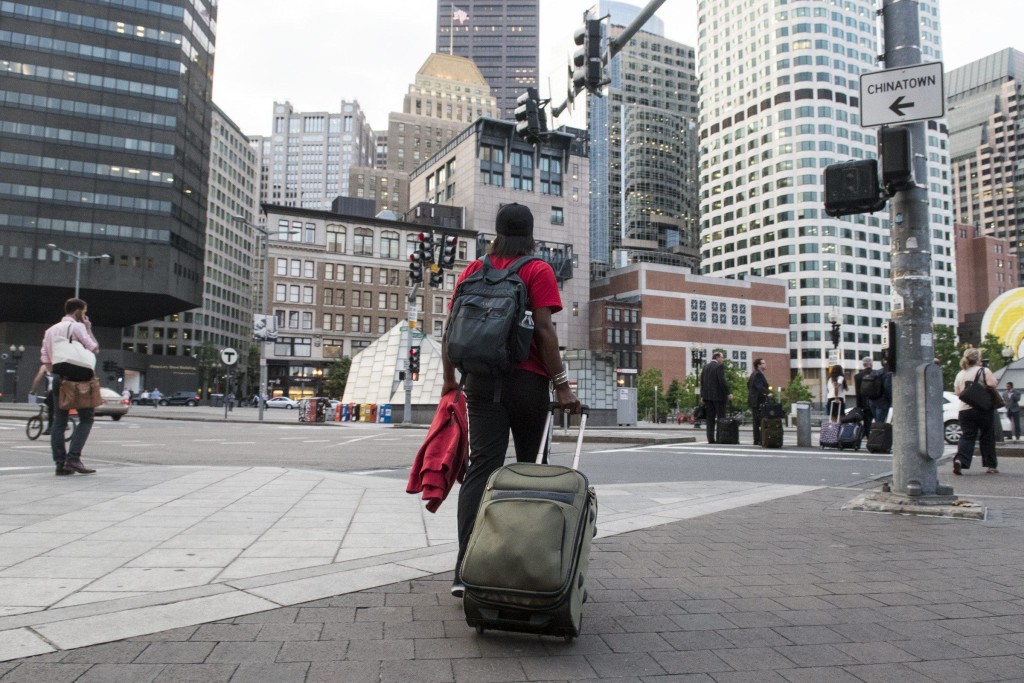 Adrienne Smith exits South Station looking for general manager Ben Brown who picks her up from the station to bring her to practice on May 28. Smith has been making the bus trip from New York City to Boston to play football for the past five years. (Wicked Local Staff Photo /Sam Goresh)